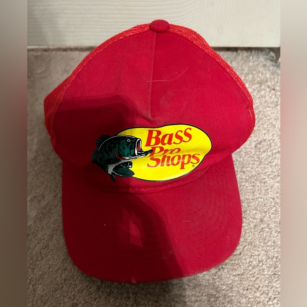Red bass pro shop trucker style hat. One size fits most. Preowned.